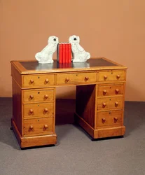 Victorian kneehole desk and a pair of Staffordshire dogs with copper lustre decoration, c.1850